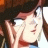 Pixelated static image of a character with long brown hair, closed eyes, and red lips in profile view against dark background.