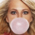 A static pixelated image shows a person with light brown hair blowing a large white bubblegum bubble, wearing red clothing.