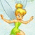 Pixelated cartoon fairy with blonde bun, green dress, and translucent wings in two poses against light blue background.