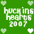 Green background with pixelated white text 'huckins hearts 2007' and light green hearts arranged in a pattern