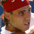 A person wearing a red headband and white shirt appears in four -aligned with subtle facial expression changes
