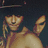Pixelated image of a shirtless person with dark hair and visible tattoos, partially obscured by a black censored overlay.
