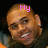 A pixelated image of a smiling person with short hair, wearing a dark top with an orange collar, against a black background.