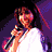 A 3x3 contact sheet of a Selena Quintanilla animated icon showing her singing with a microphone across multiple color-filtered frames and one frame with her signature.