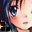 Pixelated anime-style face with blue eyes and peach skin, wearing dark green top with black square accents.