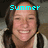 A pixelated image of a person with long dark hair wearing a light-colored jacket, with cyan text above the head changing from 'Summer' to '07'.