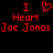 Red pixelated text and heart symbol on black background, displaying "I Heart Joe Jonas" in two identical mirrored sections.