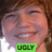 Pixelated close-up of a person's face with brown hair, showing eyes and mouth; green rectangular label at bottom reads UGLY in black capital letters.