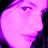 Pixelated image of a person's face with purple lighting, accompanied by bold pink text on black background.