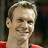 A red background displays a pixelated image of a smiling person with light brown hair and a red garment, alongside the text 'Captain Nick Lidstrom' in black block letters.