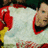 A pixelated image of a person in a red and white outfit with a red collar, set against a solid red background with white text.