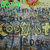 Pixelated image with green text 'DON'T TOLERATE THE' at top, repeated yellow symbols on gray background, and pink 'ggg' in lower left.