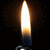 A vertical pixelated image of a bright light source with warm orange and yellow gradients against dark background, featuring subtle blue accents at the bottom.