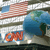 Pixelated image showing a stylized American flag with red and white stripes and blue field, a blue globe with green landmasses, and orange 'CNN' text on a blue background.