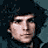 A contact sheet of five pixelated frames showing four distinct male faces and a logo, arranged in a 3x2 grid with one empty space.