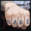 Four- shows a hand with 'MADE' tattoos, a person's face, and the name 'Borys' in script on blue