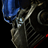 Pixelated static icon showing a blue and gray mechanical figure with red accents against black background