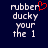 Pixelated text 'rubber ducky your the 1' on dark blue background with red heart symbol above first word.