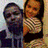 Two figures in a pixelated image: one with dark hair and blue clothing, the other with long brown hair wearing a patterned top.
