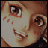 Pixelated anime-style face with brown eyes, red cheek marks, and a smiling mouth, showing text variations below the face.