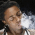 Pixelated close-up of a person with closed eyes exhaling white smoke against dark background.