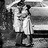 Black-and-white pixelated image of a person in motion next to large text reading 'kiss' with a dot above the 'i'.