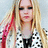 A pixelated image shows a person with long blonde hair and red streaks wearing a black-and-white checkered top, next to the word 'Diana' in bold white letters on gray background.
