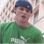 A 50x50 pixel animated buddy icon featuring a person in a green shirt and blue cap on the left side, with a dark green background displaying "Original Icons .com" text on the right side.