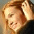 A 50x50 pixel animated buddy icon featuring a woman with long light brown hair on the left and green text reading "Original Icons .com" on a dark green background to the right, displayed as a contact sheet of two frames.