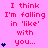 A static image displays repeated text 'I think I'm falling in 'like' with you...' in red pixelated font on a pink background, with blue heart symbols appearing in vertical