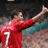 A pixelated image of a person in a red sports jersey with the number 7, raising one arm while text elements display 'Cristiano' and 'Ronaldo' in various styles.