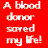 A static pixelated image with white text on a solid red background, displaying the phrase 'A blood donor saved my life!' in four lines.