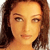 Pixelated close-up of a person with long brown hair, light skin, and neutral expression against a gradient background.