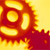 A pixelated icon with a central circular shape surrounded by layered, irregularly shaped segments in warm orange and yellow tones against a bright yellow background.