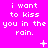 A bright pink background displays repeated white pixelated text "i want to kiss you in the rain." with small white symbols appearing and disappearing in the middle