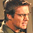 A split-frame contact sheet showing a pixelated character portrait on the left and green text logo on the right against dark background.