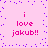 Pixelated pink background with purple dots and repeated text "i love jakub!!" in red, arranged in a pattern