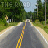 A road stretches toward the horizon under a blue sky, flanked by green trees and yellow road signs, with text changing from 'THE ROAD' to 'TO NO-WHERE' across frames.