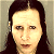 A 50x50 pixel AIM buddy icon featuring a celebrity mugshot-style image with green text overlays on a gray background, part of an animated contact sheet.