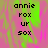 Pixelated text 'annie rox ur sox' on a pink and green gradient background with visible pixelation artifacts.