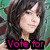 Pixelated image of a woman with long dark hair and bangs, wearing a black top against a green background.