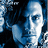 Pixelated blue-toned portrait of a person with dark hair on left, green text reading "The One That Started It All!" in four sections against black and gray backgrounds.