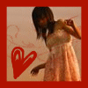 A static image shows a person in a light-colored dress with a red border and a red heart symbol on the left side.