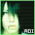 Pixelated green-toned image of a character with a tall pointed hat and striped face, set against a black striped background with 'AOI' text at bottom right.
