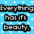 Pixelated text on a light blue background with white dots, displaying two phrases in black-outlined white letters.
