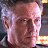 A 4-frame contact sheet of a Christopher Walken character from The Rundown, showing facial expressions and text overlay in a pixelated animation style.