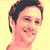 Static pixelated image of a person's head and shoulders against a solid yellow background with visible dithering and color blending artifacts.