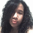 Pixelated close-up of a person with long dark hair, light skin tone, and closed eyes in profile view against white background.