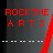 Pixelated red text 'ROCK THE ART' on dark background with white horizontal dashes below, right side has vertical red pixel strip.