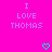 Bright pink background with repeated text "I LOVE THOMAS" in light purple pixelated font and scattered cyan heart symbols.
